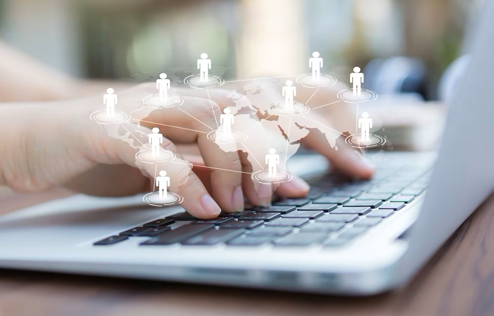 Hands with Laptop Virtual World Map